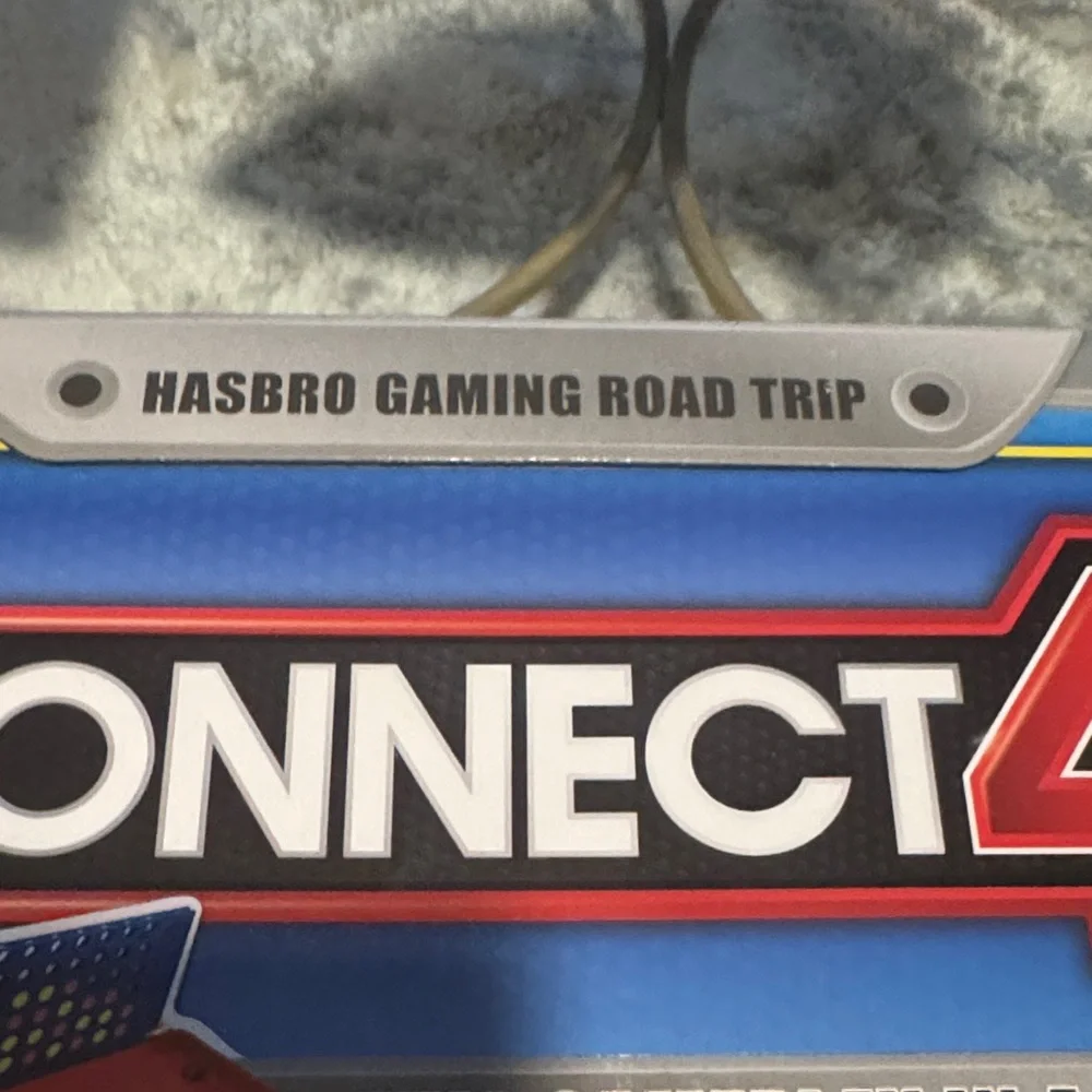 Hasbro Gaming Road Trip Connect 4 Portable Game Tin in Blue and Silver